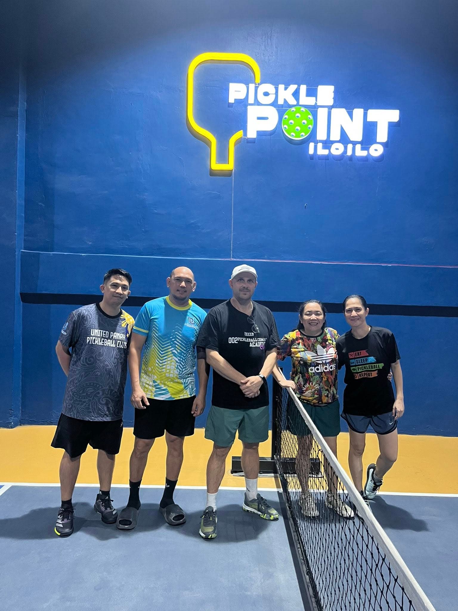 Players at PicklePoint net